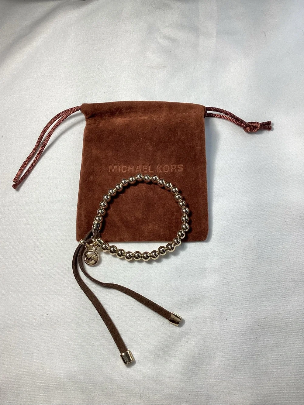 Michael Kors NWT and Dust Bag Gold-Tone Beaded Brown Suede Logo Charm Bracelet